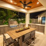 Custom Outdoor Kitchen Dining Area with Hestan Gas Grill Side Burner Fridge and Ice Maker Installed in Tampa Florida WEB