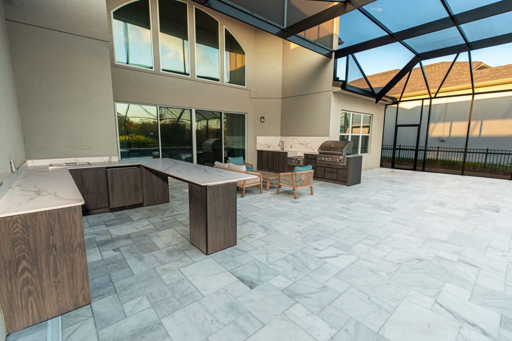 Custom Designed Outdoor Kitchen With Bar Setup in Wesley Chapel by Just Grillin Outdoor Living WEB