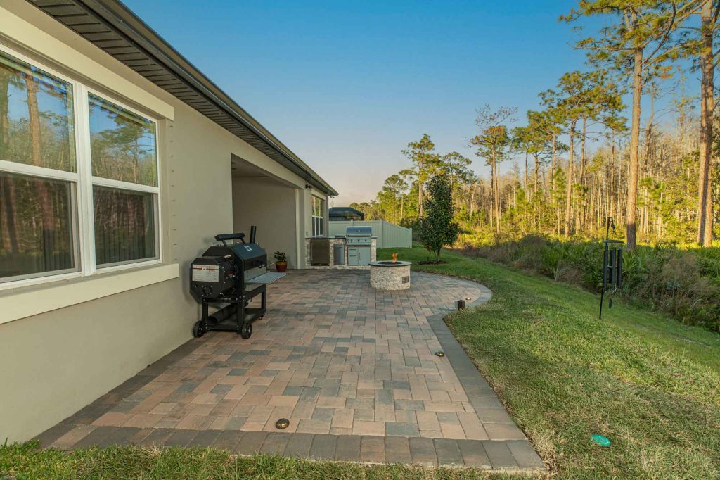 Custom Hardscape Patio With Outdoor Kitchen and Fire Pit Tampa Florida WEB