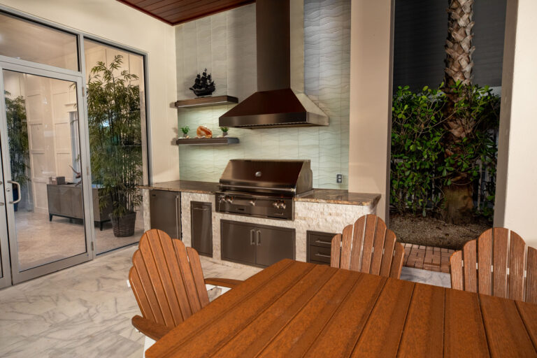 Custom Outdoor Kitchen With Alfresco Grill Falmec Vent Hood and Wall Shelves Anna Maria Island Florida WEB