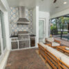 Custom Outdoor Kitchen With Gas Grill, Tile Wall and Vent Hood in Tampa Florida WEB