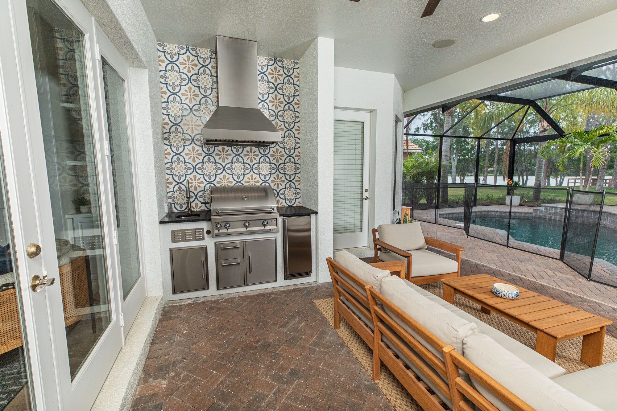 Custom Outdoor Kitchen With Gas Grill, Tile Wall and Vent Hood in Tampa Florida WEB