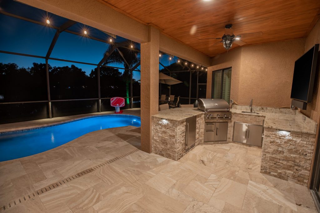 Custom Outdoor Kitchen With Panel Ceiling And Travertine Deck WEB