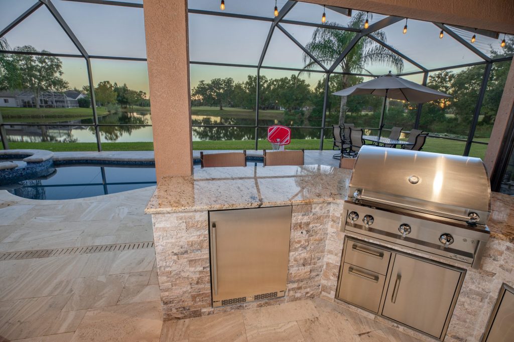 Outdoor Kitchen Grill Overlooking Pool and Patio WEB