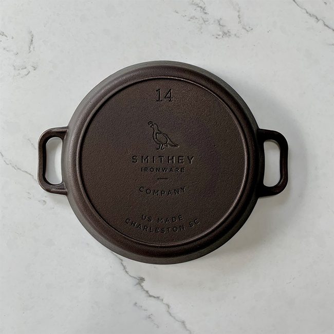 https://justgrillinflorida.com/wp-content/uploads/Smithey-Ironware-Co.-No.-14-Dual-Handle-Cast-Iron-Skillet-Bottom.jpg