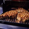 Weber Summit Cooking Steaks on Stainless Grates