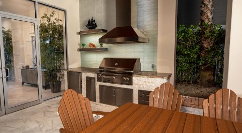 Custom Outdoor Kitchen With Alfresco Grill Falmec Vent Hood and Wall Shelves Anna Maria Island Florida WEB