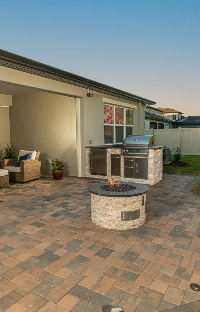 Hardscape Patio With Outdoor Kitchen Fire Pit and Lighting Tampa Florida WEB